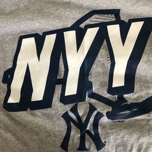 Grey yankees shirt.